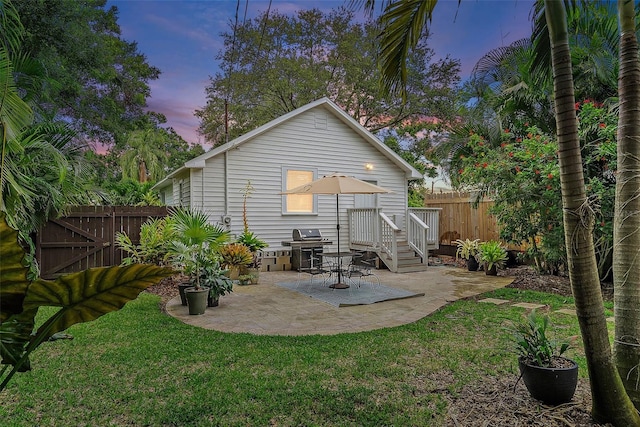 1211 14th St N, Saint Petersburg, FL 33705 - back of house at dusk with a patio