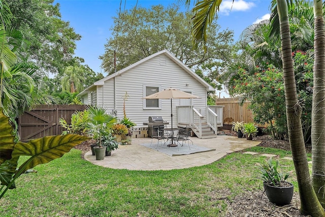 1211 14th St N, Saint Petersburg, FL 33705 - back of property featuring a patio and a gate