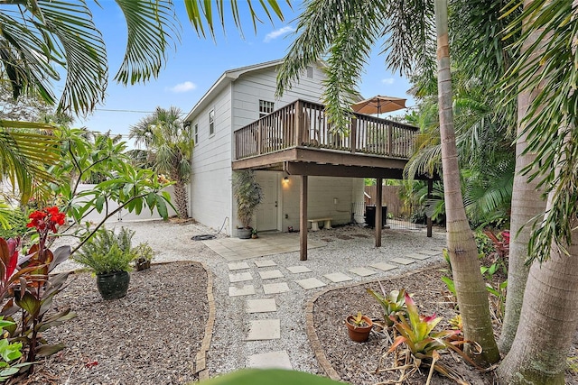 1211 14th St N, Saint Petersburg, FL 33705 - back of house with a deck and a patio area