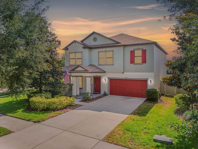 11802 Twilight Darner Pl, Riverview, FL 33569 - view of front facade with stucco siding, an attached garage, concrete driveway, roof with shingles, and covered porch