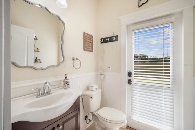 11802 Twilight Darner Pl, Riverview, FL 33569 - half bathroom with a wainscoted wall, vanity, and toilet