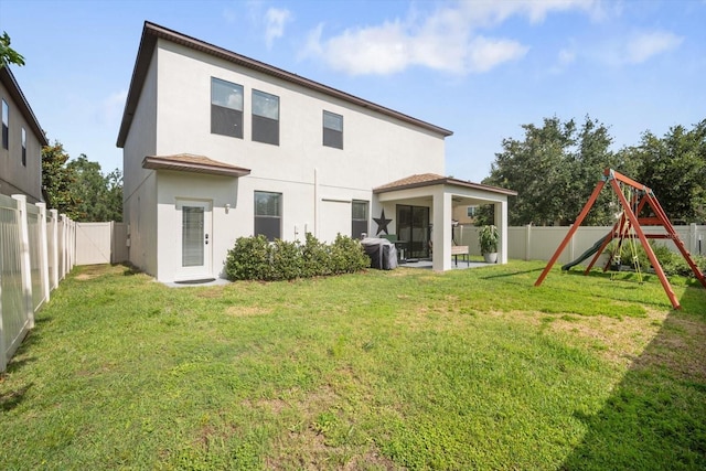 11802 Twilight Darner Pl, Riverview, FL 33569 - back of property featuring stucco siding, a playground, and a sunroom