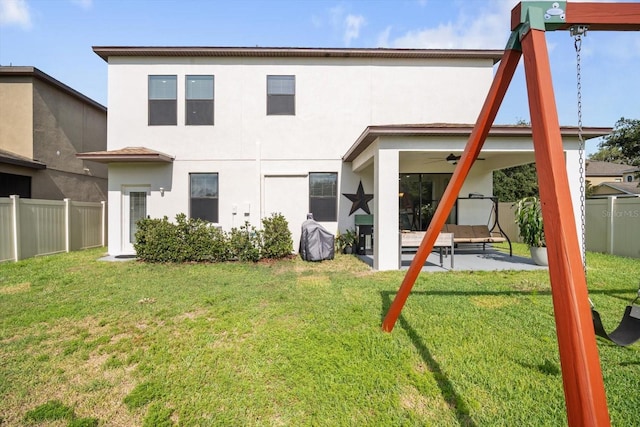 11802 Twilight Darner Pl, Riverview, FL 33569 - back of property with stucco siding, a patio area, and ceiling fan