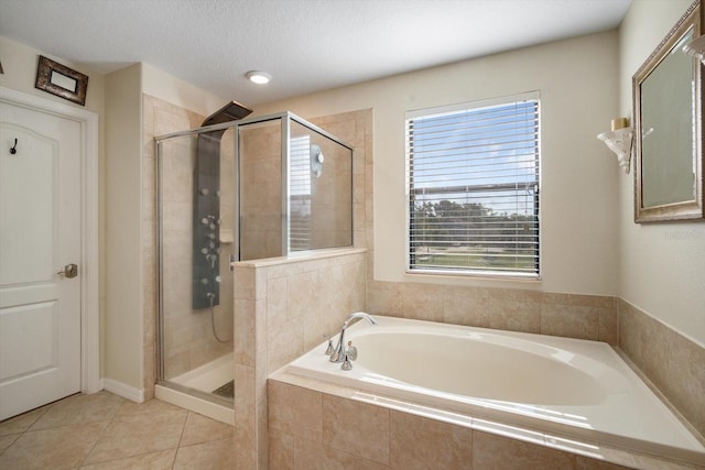 11802 Twilight Darner Pl, Riverview, FL 33569 - full bath with a bath, a stall shower, and tile patterned floors