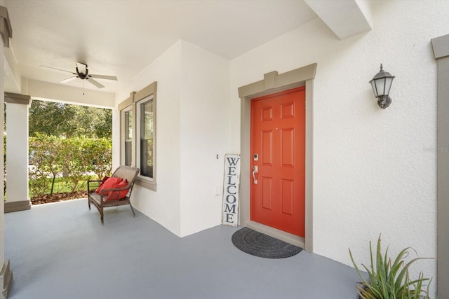 11802 Twilight Darner Pl, Riverview, FL 33569 - entrance to property with covered porch, ceiling fan, and stucco siding