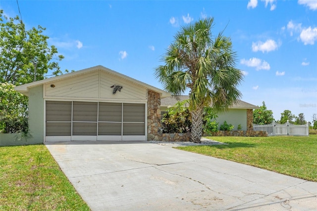 3226 Gardenia Dr, Hernando Beach, FL 34607 - view of front of house with stone siding, stucco siding, and concrete driveway