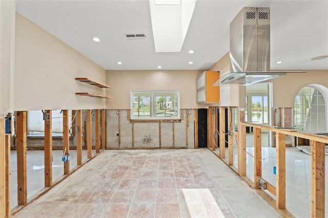3226 Gardenia Dr, Hernando Beach, FL 34607 - kitchen featuring healthy amount of natural light, island range hood, and recessed lighting