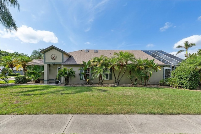 892 Crestridge Cir, Tarpon Springs, FL 34688 - view of front of property featuring stucco siding, a front lawn, and a shingled roof