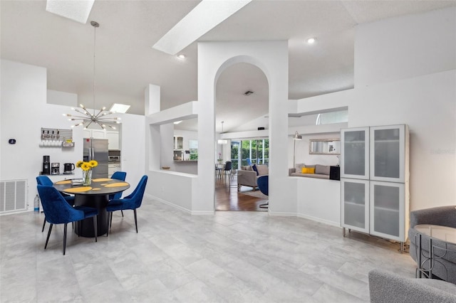892 Crestridge Cir, Tarpon Springs, FL 34688 - dining area featuring high vaulted ceiling, a chandelier, arched walkways, recessed lighting, and baseboards