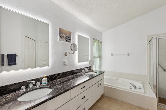 892 Crestridge Cir, Tarpon Springs, FL 34688 - full bath with a shower stall, double vanity, a garden tub, a textured ceiling, and tile patterned flooring