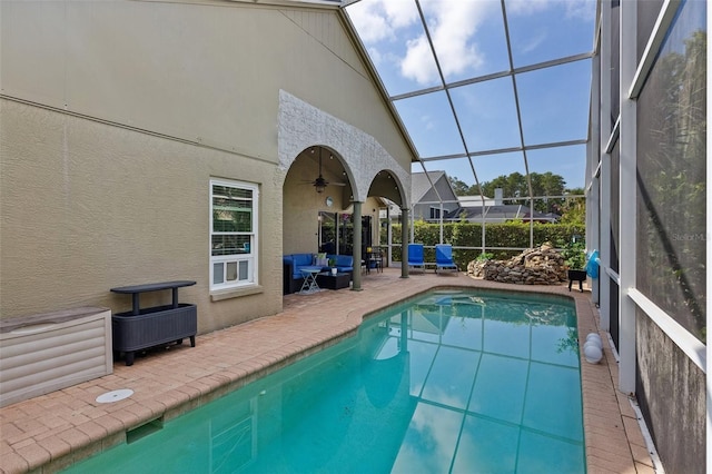 892 Crestridge Cir, Tarpon Springs, FL 34688 - view of swimming pool with a patio, an outdoor living space, glass enclosure, and ceiling fan