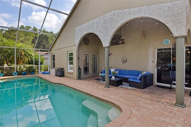 892 Crestridge Cir, Tarpon Springs, FL 34688 - outdoor pool with french doors, a patio, an outdoor hangout area, a lanai, and ceiling fan