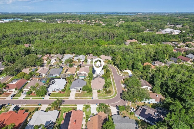 892 Crestridge Cir, Tarpon Springs, FL 34688 - aerial overview of property's location featuring nearby suburban area and a forest