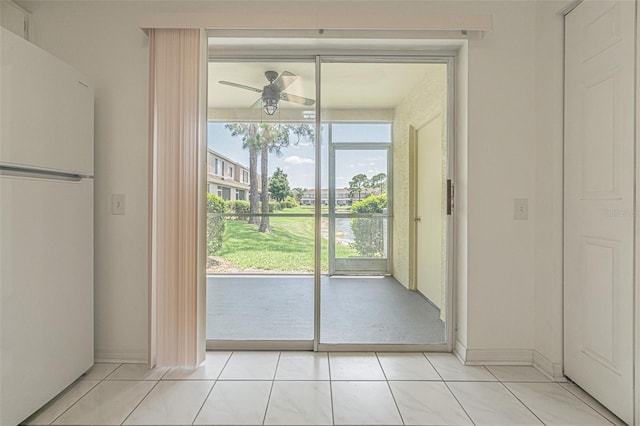 6229 Bayside Key Dr, Tampa, FL 33615 - doorway to outside with ceiling fan and light tile patterned floors