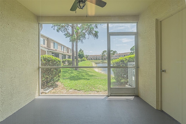 6229 Bayside Key Dr, Tampa, FL 33615 - unfurnished sunroom with ceiling fan, a water view, and plenty of natural light