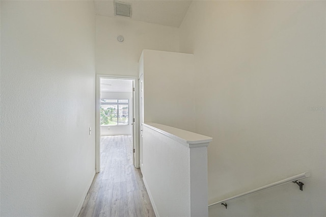 6229 Bayside Key Dr, Tampa, FL 33615 - hall featuring an upstairs landing, light wood-style flooring, and baseboards