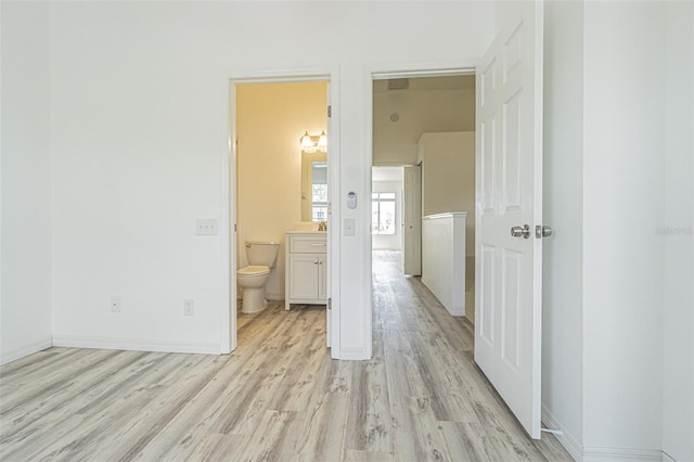 6229 Bayside Key Dr, Tampa, FL 33615 - unfurnished bedroom with light wood finished floors, ensuite bathroom, and baseboards