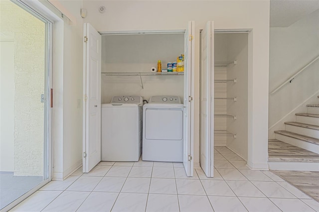 6229 Bayside Key Dr, Tampa, FL 33615 - laundry area featuring washer and dryer and light tile patterned floors