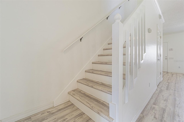 6229 Bayside Key Dr, Tampa, FL 33615 - stairway with wood finished floors and a textured ceiling