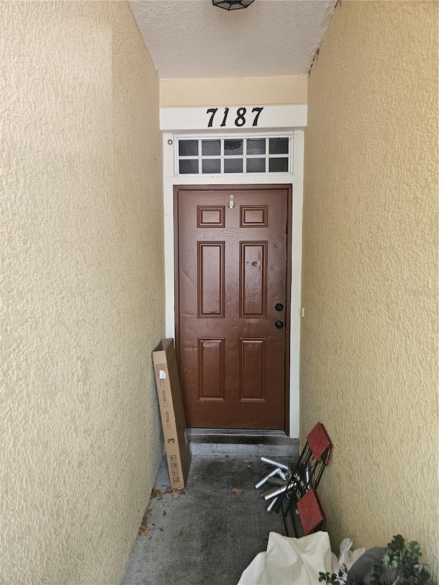 7187 53rd St N, Pinellas Park, FL 33781 - doorway to property with stucco siding