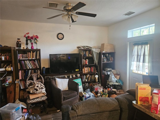 7187 53rd St N, Pinellas Park, FL 33781 - living area with ceiling fan and wood finished floors