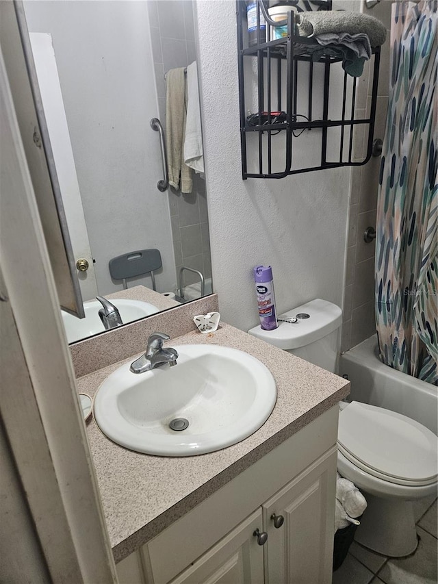7187 53rd St N, Pinellas Park, FL 33781 - full bathroom with vanity, toilet, a textured wall, and shower / bathtub combination with curtain