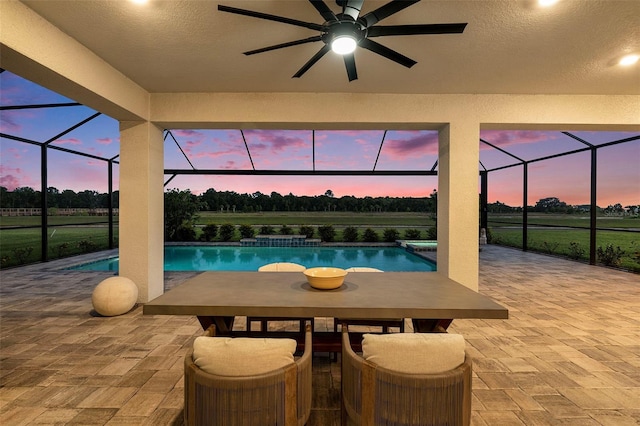 33774 Castaway Loop, Wesley Chapel, FL 33543 - view of pool with a lanai, a patio area, ceiling fan, and outdoor dining area