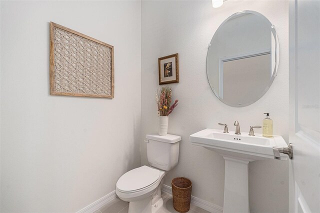 33774 Castaway Loop, Wesley Chapel, FL 33543 - bathroom with toilet, baseboards, and a sink