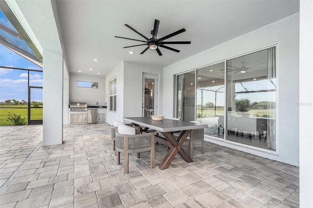33774 Castaway Loop, Wesley Chapel, FL 33543 - view of patio featuring a ceiling fan, a lanai, and outdoor dining area