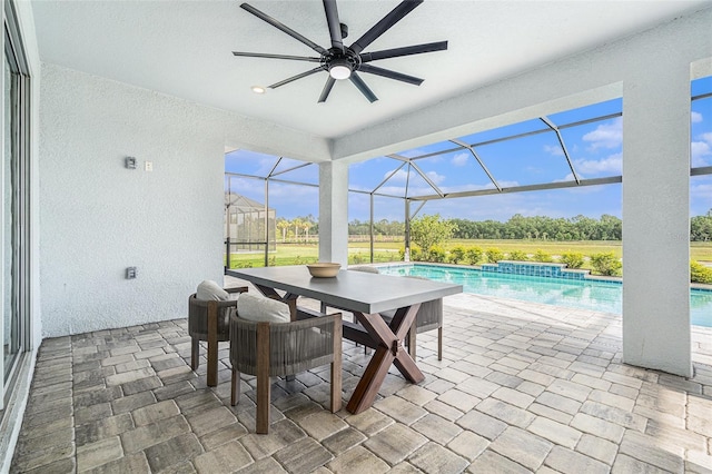 33774 Castaway Loop, Wesley Chapel, FL 33543 - view of patio / terrace featuring ceiling fan, an outdoor pool, and glass enclosure