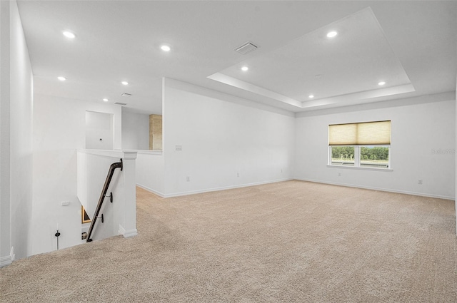 33774 Castaway Loop, Wesley Chapel, FL 33543 - spare room featuring light carpet, recessed lighting, baseboards, and a raised ceiling