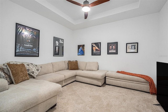 33774 Castaway Loop, Wesley Chapel, FL 33543 - living area with a ceiling fan, a raised ceiling, and carpet flooring