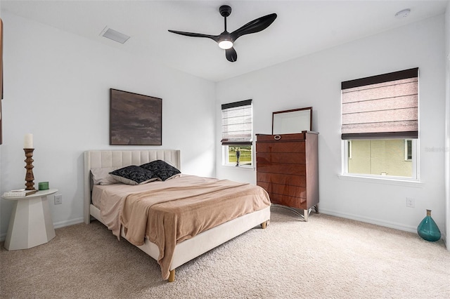 33774 Castaway Loop, Wesley Chapel, FL 33543 - bedroom with carpet floors, baseboards, and a ceiling fan