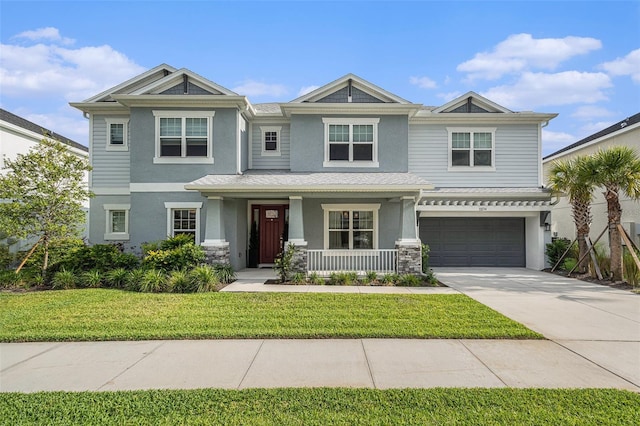 33774 Castaway Loop, Wesley Chapel, FL 33543 - view of front of property with stucco siding, a porch, concrete driveway, a front yard, and an attached garage