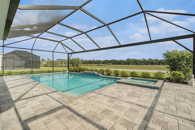 33774 Castaway Loop, Wesley Chapel, FL 33543 - view of swimming pool featuring a patio, a pool with connected hot tub, and a lanai