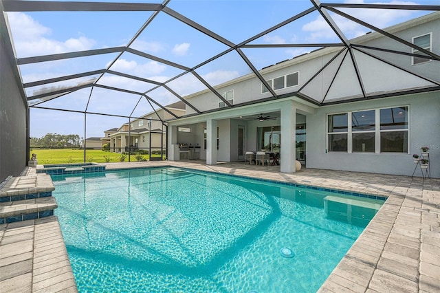 33774 Castaway Loop, Wesley Chapel, FL 33543 - view of pool with ceiling fan, a patio area, a pool with connected hot tub, a lanai, and outdoor dining space