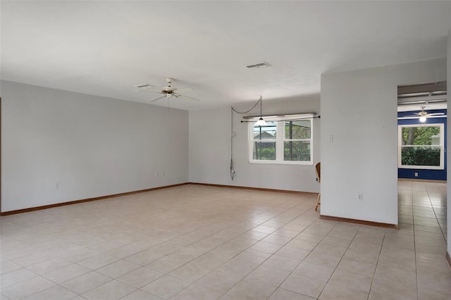 8332 Berkeley Manor Blvd, Spring Hill, FL 34606 - empty room with plenty of natural light, ceiling fan, and baseboards