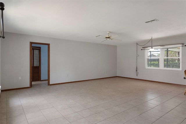 8332 Berkeley Manor Blvd, Spring Hill, FL 34606 - spare room with a ceiling fan and baseboards