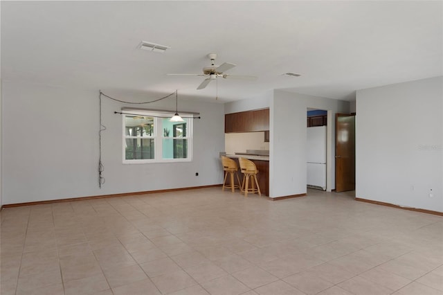 8332 Berkeley Manor Blvd, Spring Hill, FL 34606 - unfurnished living room featuring a ceiling fan and baseboards