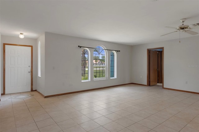 8332 Berkeley Manor Blvd, Spring Hill, FL 34606 - unfurnished room featuring ceiling fan, baseboards, and light tile patterned floors