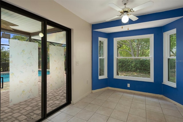 8332 Berkeley Manor Blvd, Spring Hill, FL 34606 - unfurnished room with baseboards, ceiling fan, and tile patterned floors