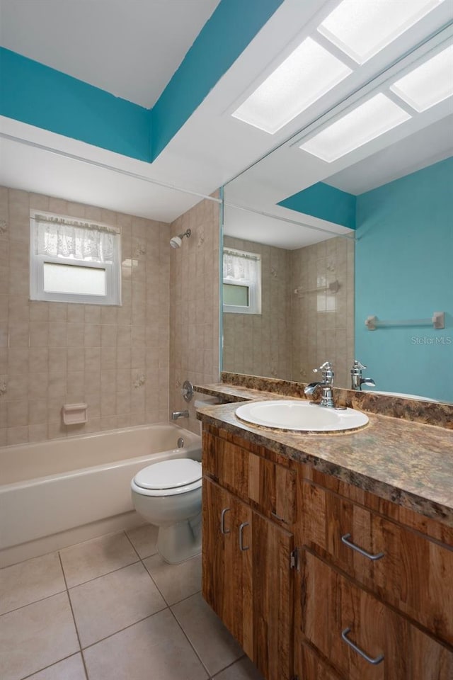 8332 Berkeley Manor Blvd, Spring Hill, FL 34606 - full bathroom featuring tile patterned flooring, toilet, vanity, and healthy amount of natural light