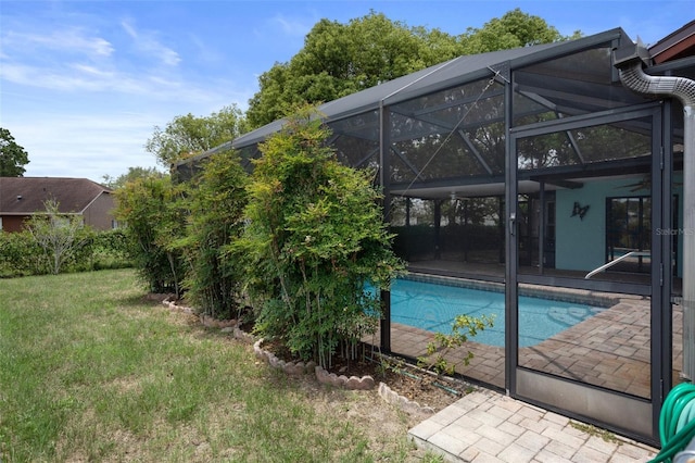 8332 Berkeley Manor Blvd, Spring Hill, FL 34606 - outdoor pool with a patio area, a lawn, ceiling fan, and a lanai