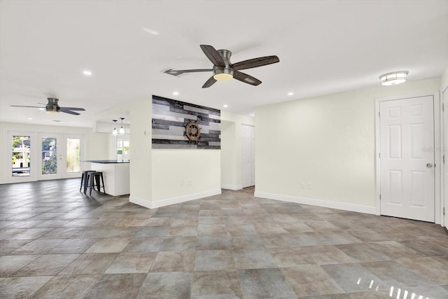 13926 Darlene Ave, Hudson, FL 34667 - unfurnished living room with a ceiling fan, baseboards, recessed lighting, and stone finish flooring