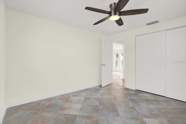 13926 Darlene Ave, Hudson, FL 34667 - unfurnished bedroom featuring a closet, baseboards, and a ceiling fan