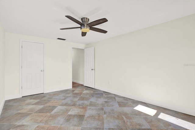 13926 Darlene Ave, Hudson, FL 34667 - spare room with a ceiling fan and baseboards