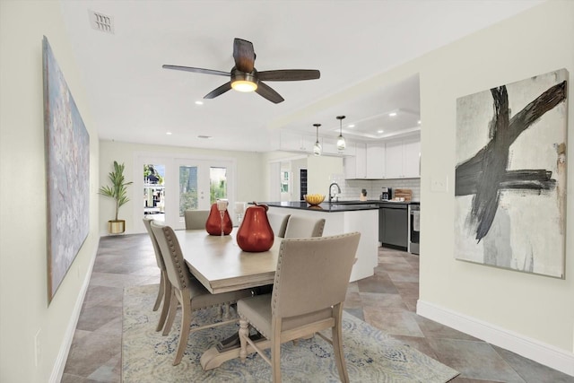 13926 Darlene Ave, Hudson, FL 34667 - dining area featuring baseboards, recessed lighting, a raised ceiling, and ceiling fan