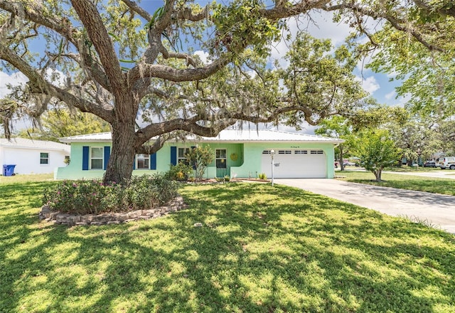 1022 Greenbriar Dr, Brandon, FL 33511 - ranch-style house featuring an attached garage, driveway, stucco siding, and a front yard