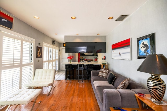 1022 Greenbriar Dr, Brandon, FL 33511 - living room featuring wood finished floors, bar area, and recessed lighting