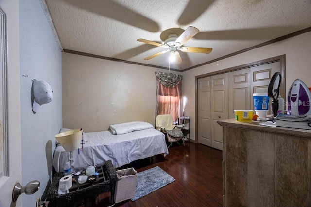 1468 Wigmore St SE, Palm Bay, FL 32909 - bedroom with a textured ceiling, crown molding, wood finished floors, ceiling fan, and a closet